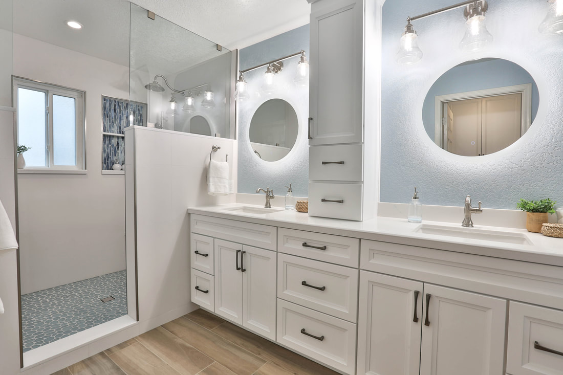white cabinets lighten snd brighten this timeless bath design