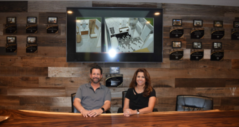 Owners Gina Varela-Domenichini and Dave Domenichini in their conference room